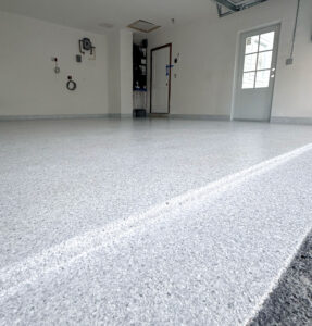 White Epoxy Garage Floor. Schist, cove base